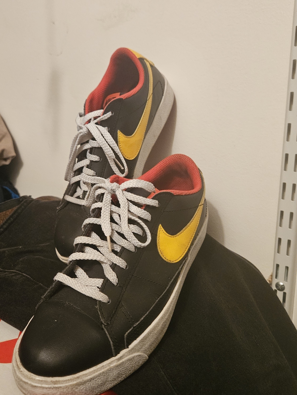 Nike Men's Black Sneakers with Yellow Swoosh and Red Lining